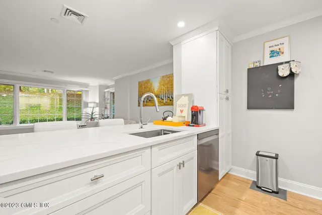 a kitchen with sink and window