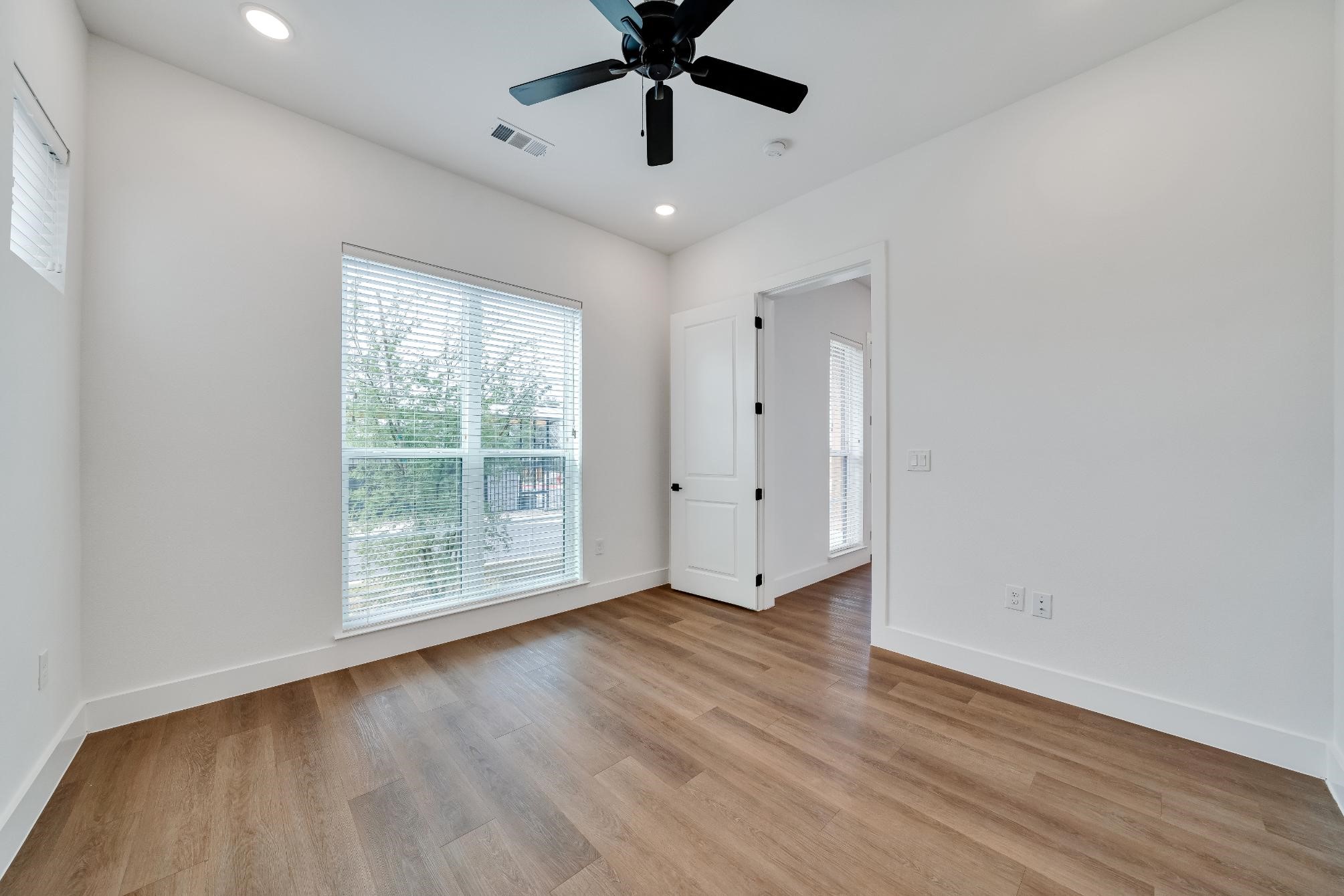 1601-121 Mustang Drive Marble Falls, TX 78654 - Photo 14 of 26 a view of room with window ceiling fan and hardwood floor