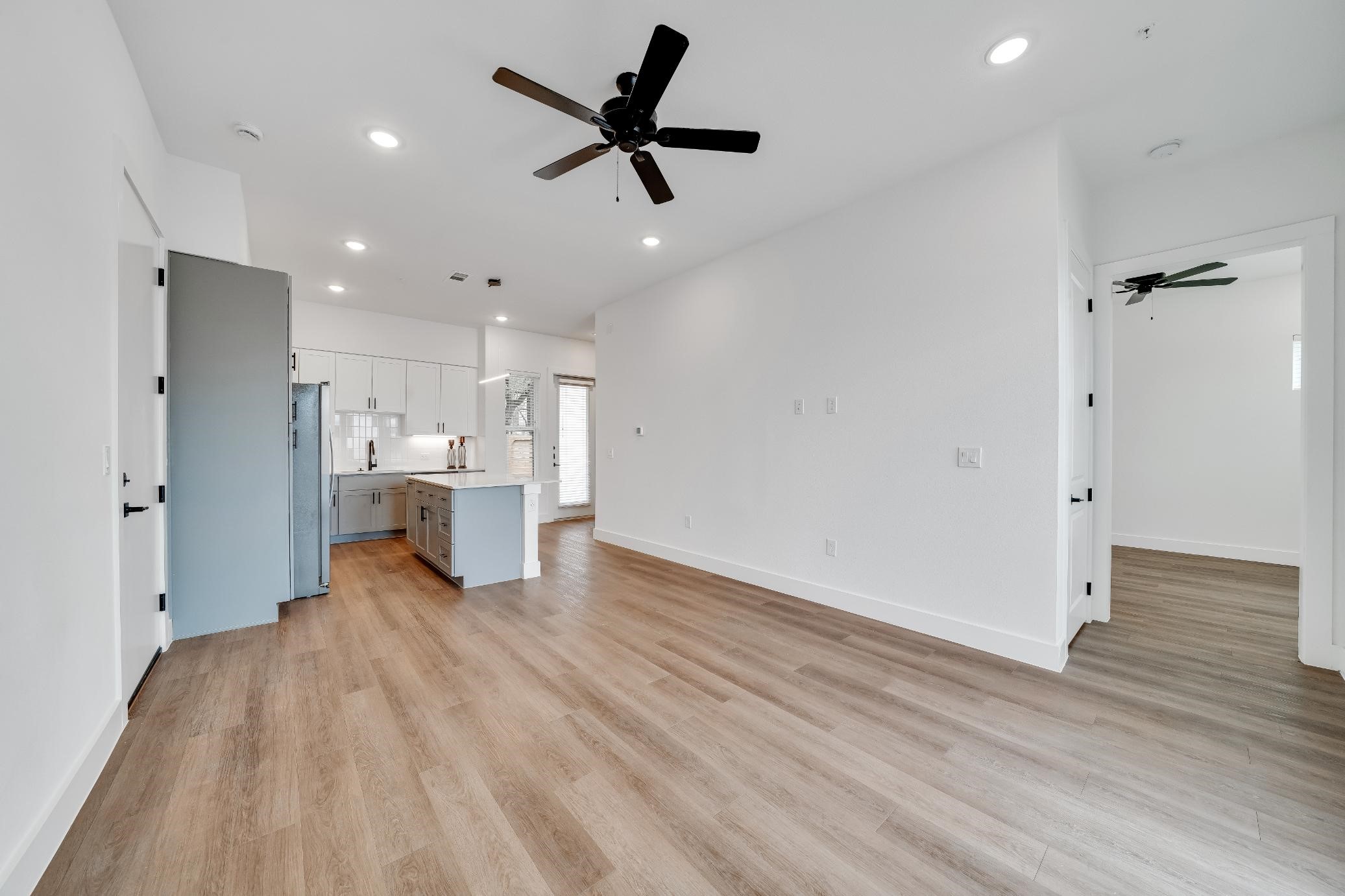 1601-121 Mustang Drive Marble Falls, TX 78654 - Photo 2 of 26 a view of a kitchen with wooden floor and a sink