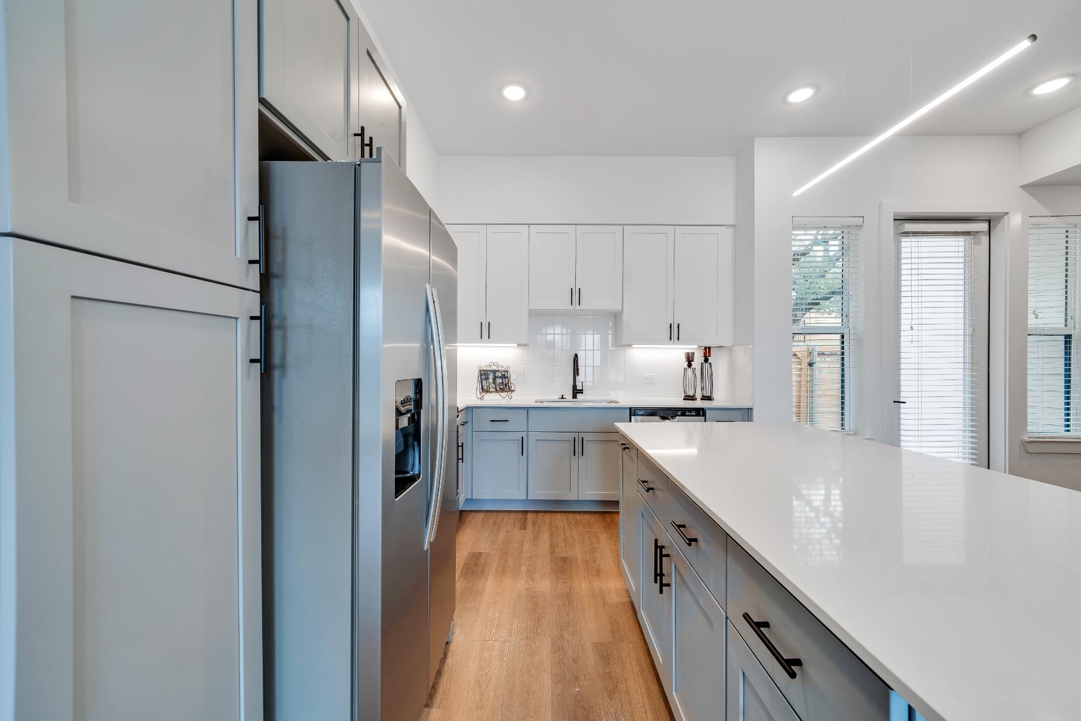 1601-121 Mustang Drive Marble Falls, TX 78654 - Photo 7 of 26 a large kitchen with stainless steel appliances kitchen island granite countertop a refrigerator and a sink