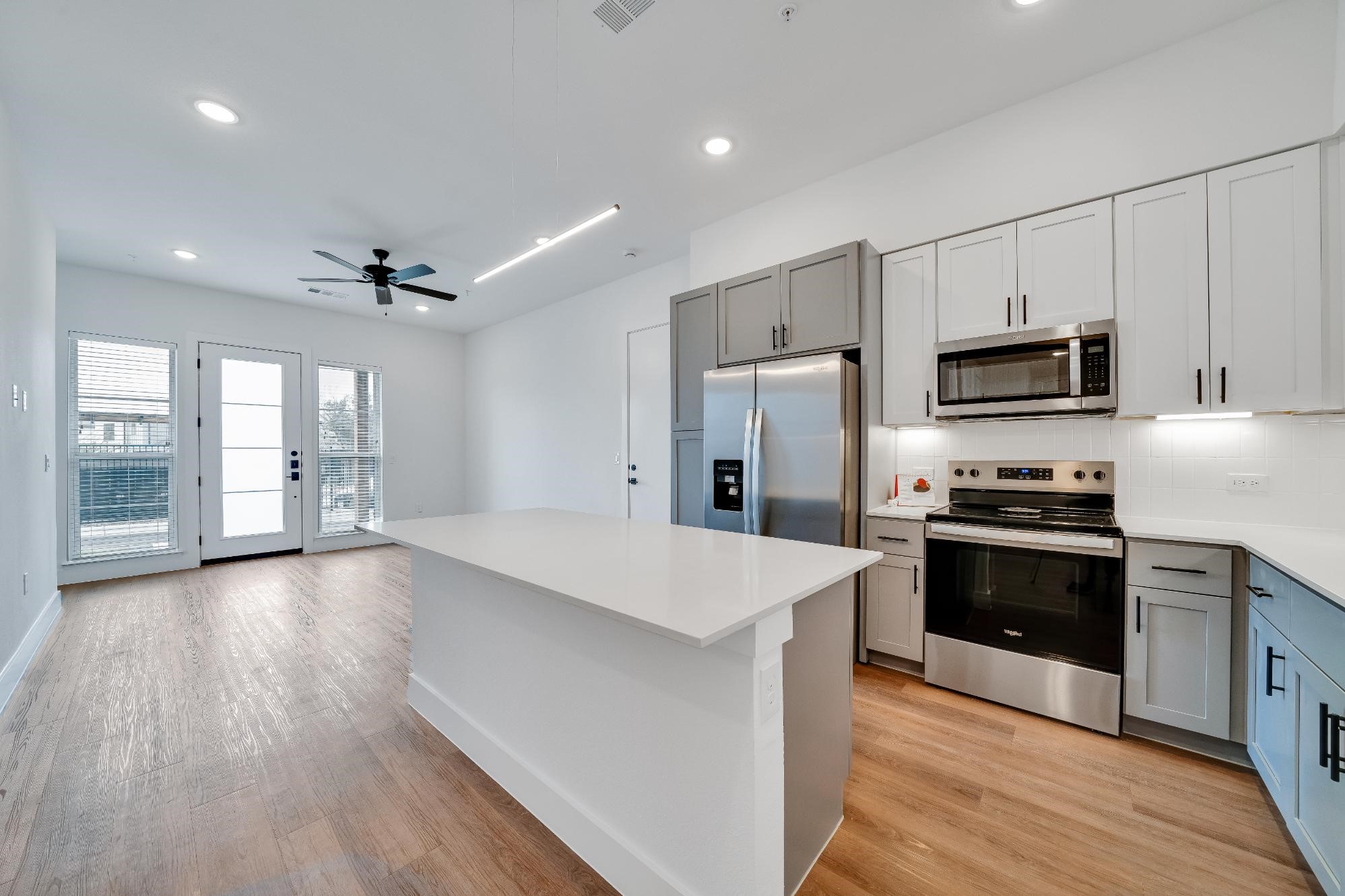 1601-121 Mustang Drive Marble Falls, TX 78654 - Photo 9 of 26 a large kitchen with stainless steel appliances granite countertop a stove and a refrigerator