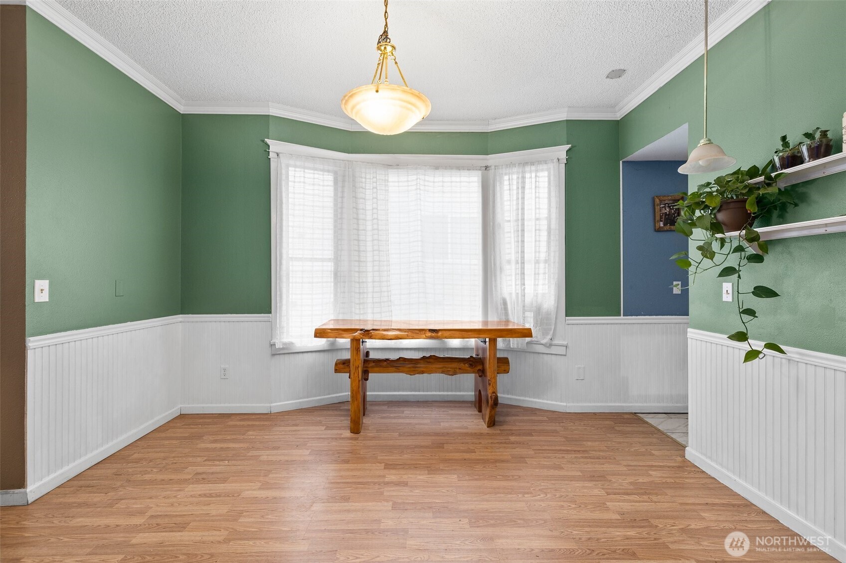 3710 Rucker Avenue Everett, WA 98201 - Photo 12 of 33 a view of a room with wooden floor and furniture