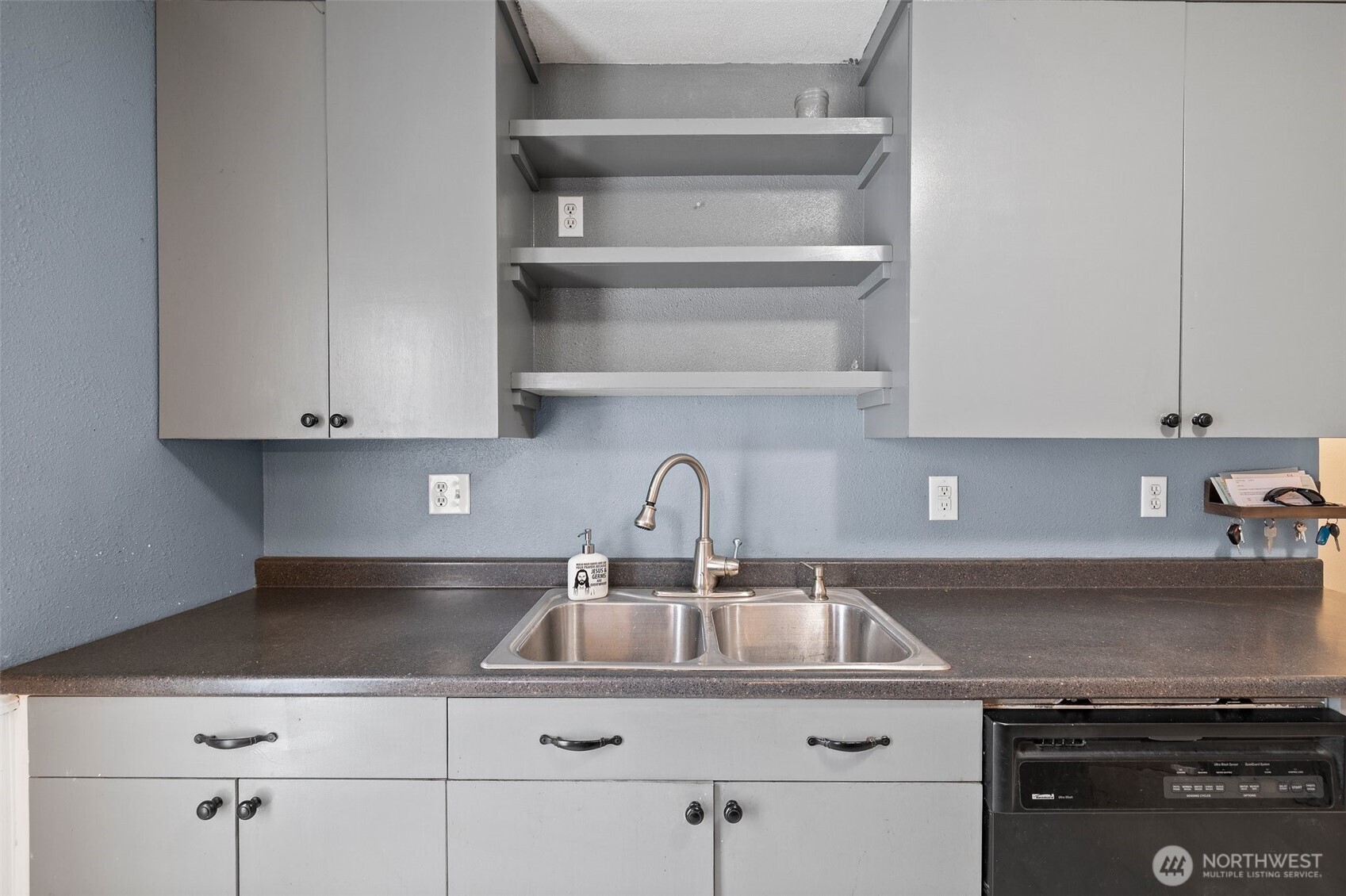 3710 Rucker Avenue Everett, WA 98201 - Photo 18 of 33 a kitchen with white cabinets and a sink