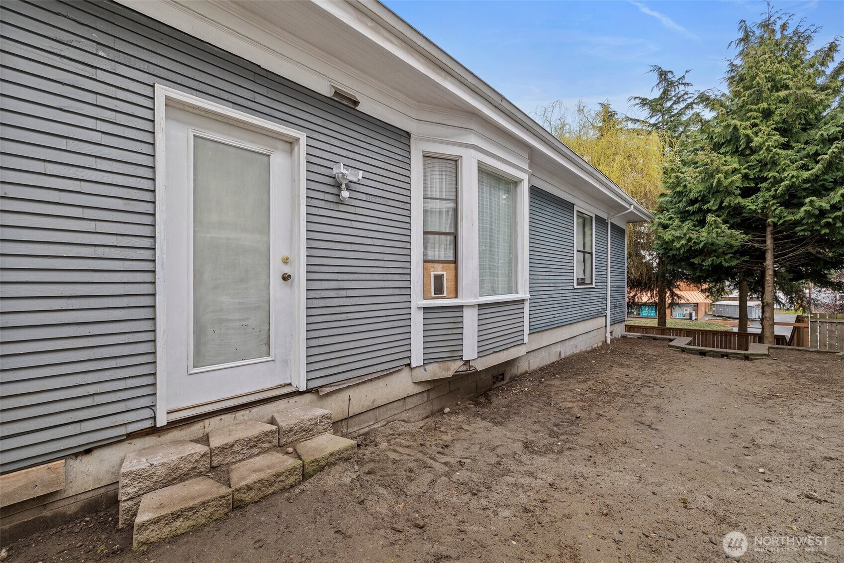 3710 Rucker Avenue Everett, WA 98201 - Photo 27 of 33 a backyard of a house with barbeque oven and a tree