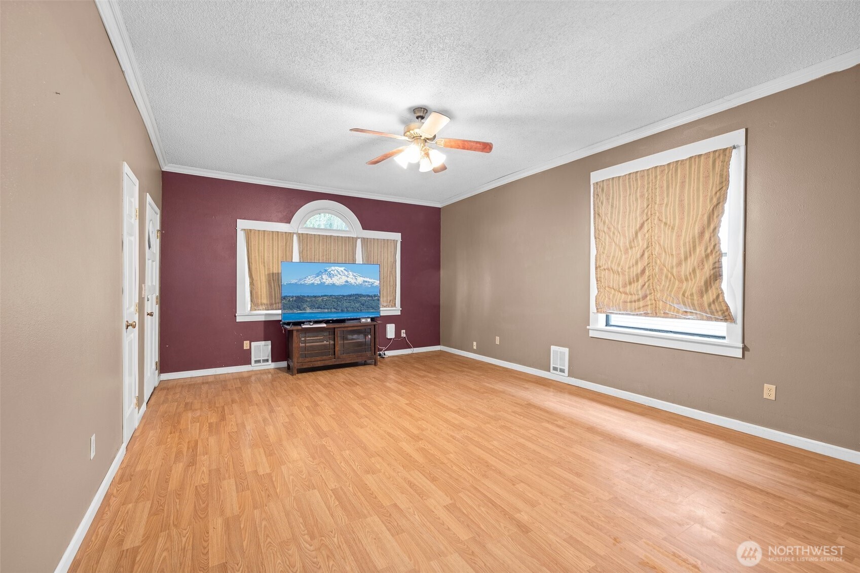 3710 Rucker Avenue Everett, WA 98201 - Photo 5 of 33 a view of an empty room with chandelier fan and a window