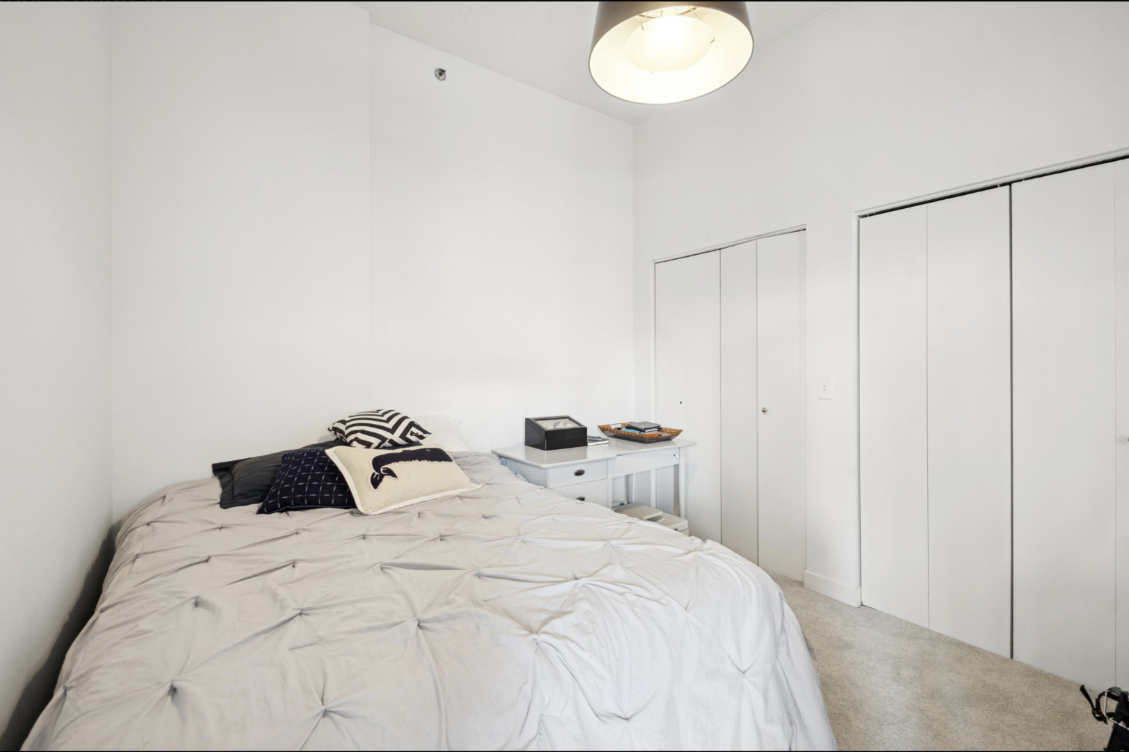 910 West Madison Street, Unit 408 Chicago, IL 60607 - Photo 11 of 16 a bedroom with a bed and a table