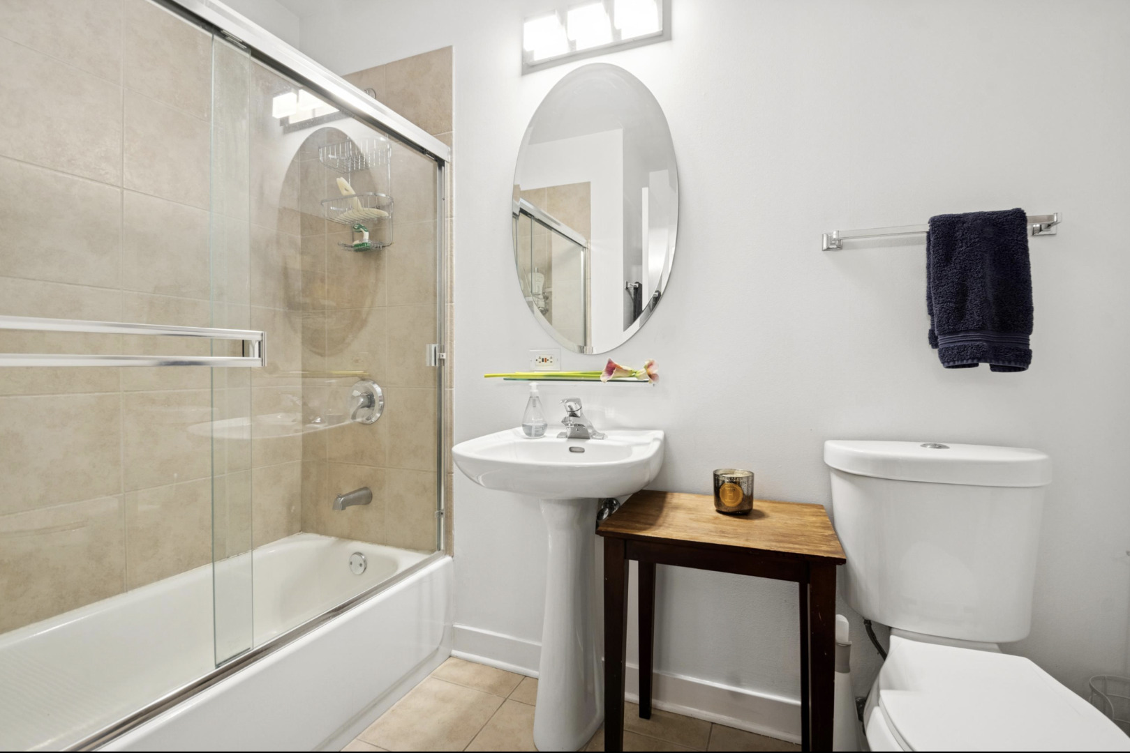 910 West Madison Street, Unit 408 Chicago, IL 60607 - Photo 13 of 16 a bathroom with a sink a toilet and bathtub