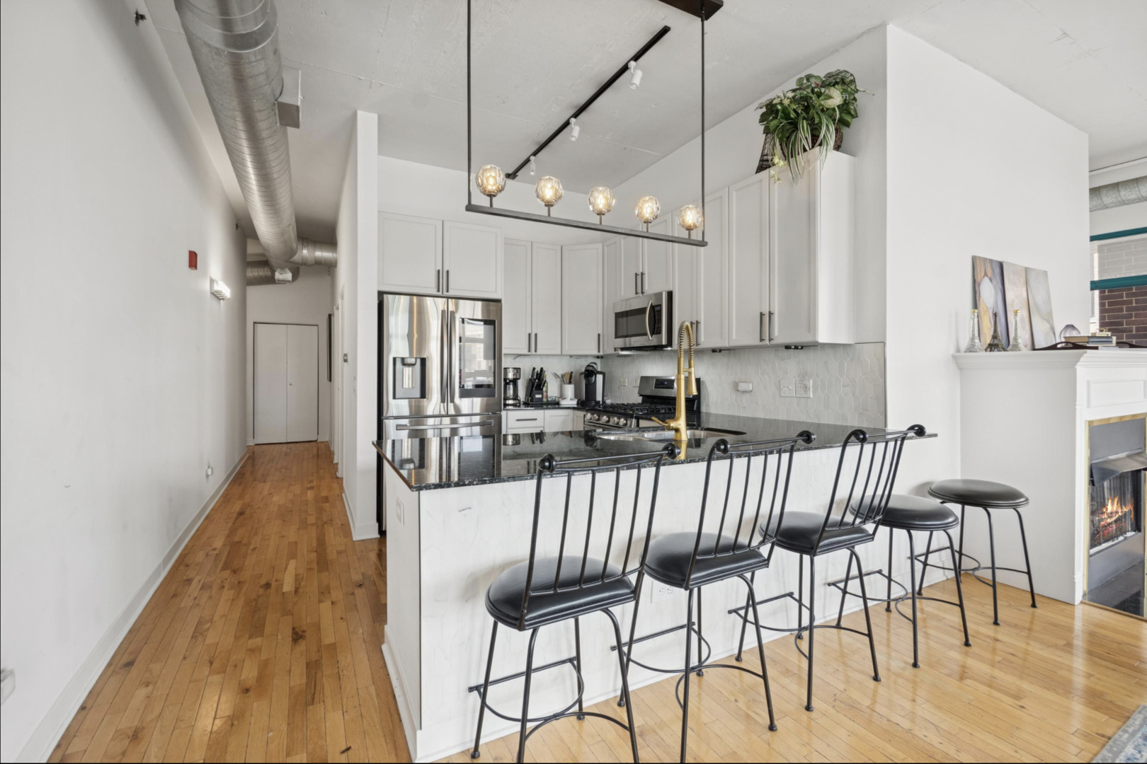910 West Madison Street, Unit 408 Chicago, IL 60607 - Photo 5 of 16 a view of kitchen and dining area with furniture