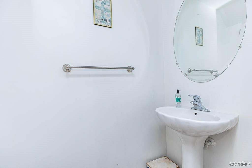 12124 Perdue Springs Loop Chester, VA 23831 - Photo 13 of 26 a bathroom with a sink and mirror