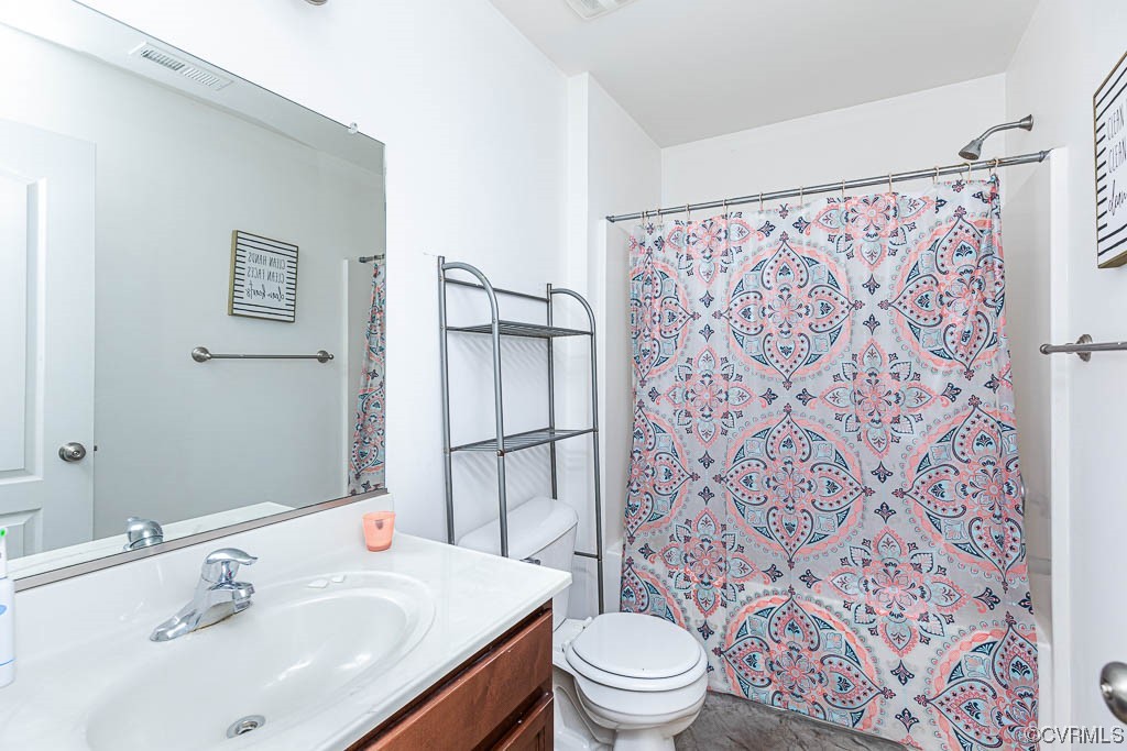 12124 Perdue Springs Loop Chester, VA 23831 - Photo 14 of 26 a bathroom with a sink toilet and shower