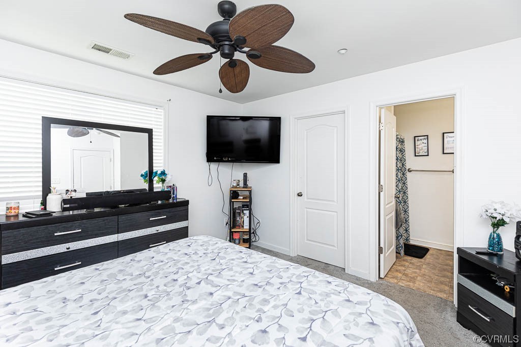 12124 Perdue Springs Loop Chester, VA 23831 - Photo 16 of 26 a bedroom with a bed and a flat screen tv