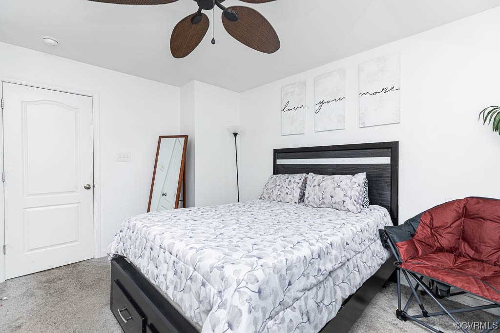 12124 Perdue Springs Loop Chester, VA 23831 - Photo 19 of 26 a bedroom with a bed and wooden floor