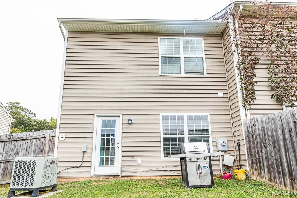 12124 Perdue Springs Loop Chester, VA 23831 - Photo 25 of 26 a view of a house with a yard and a deck