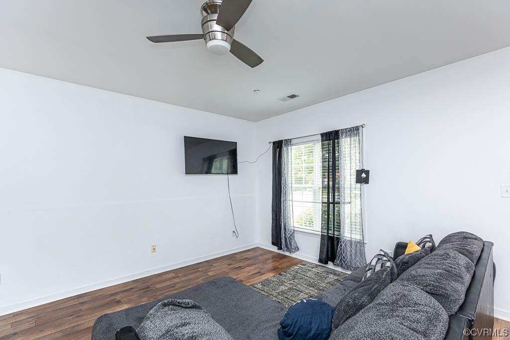 12124 Perdue Springs Loop Chester, VA 23831 - Photo 3 of 26 a bedroom with a bed and a flat screen tv