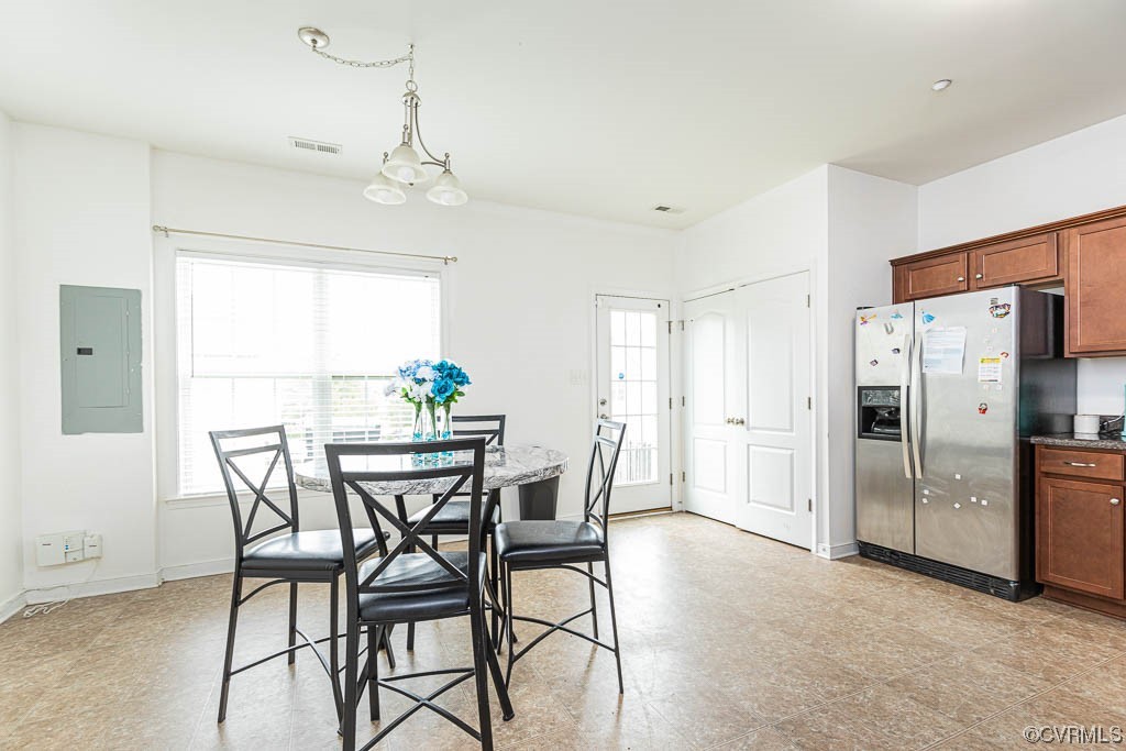 12124 Perdue Springs Loop Chester, VA 23831 - Photo 6 of 26 a view of a dining room with furniture window and wooden floor