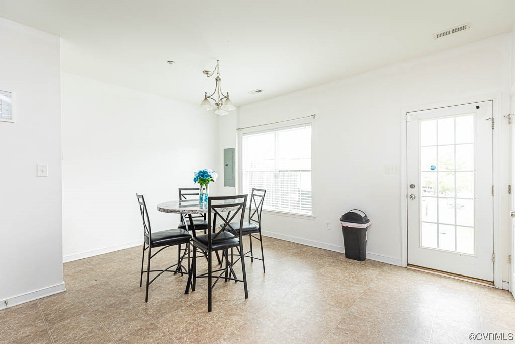 12124 Perdue Springs Loop Chester, VA 23831 - Photo 7 of 26 a view of a dining room with furniture and window