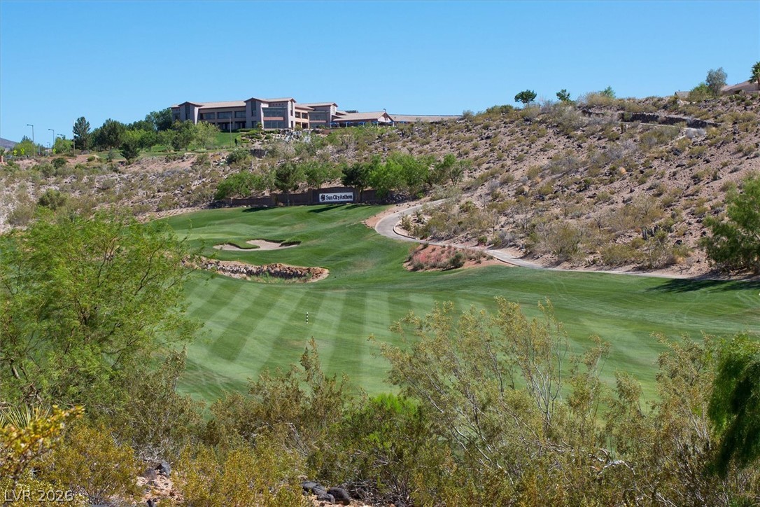 1823 Baton Rouge Street Henderson, NV 89052 - Photo 52 of 60 Lush fairways wind through the rolling desert landscape under a clear blue sky.