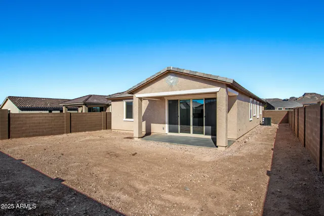 a view of wooden fence in front of house