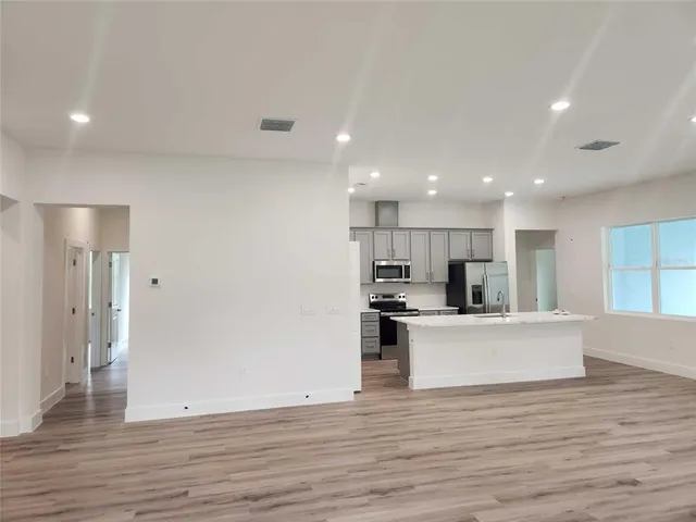 a view of kitchen with wooden floor