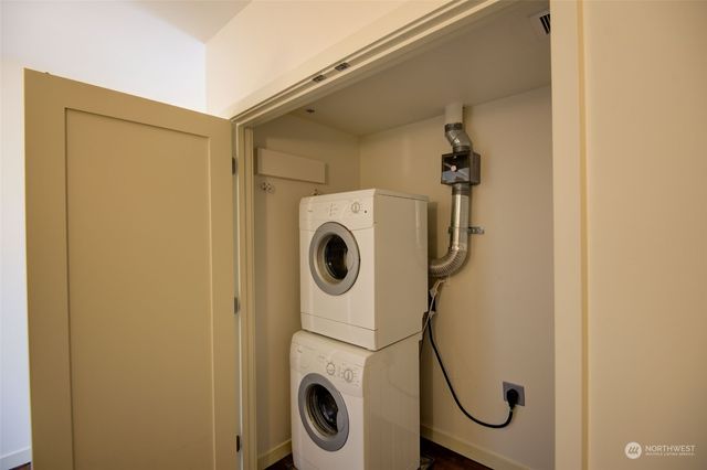 a roof deck with a table and chairs