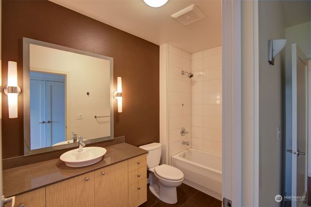 a bedroom with furniture and a potted plant