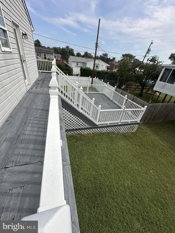 a view of a swimming pool with a roof deck