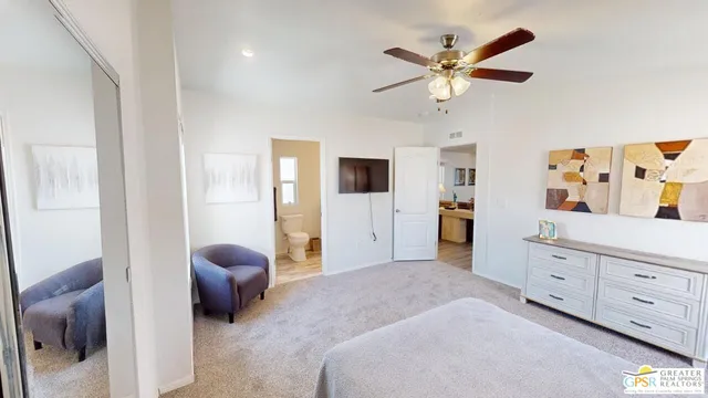 a bedroom with furniture and window