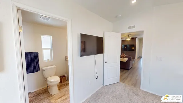 a bathroom with a toilet sink and shower