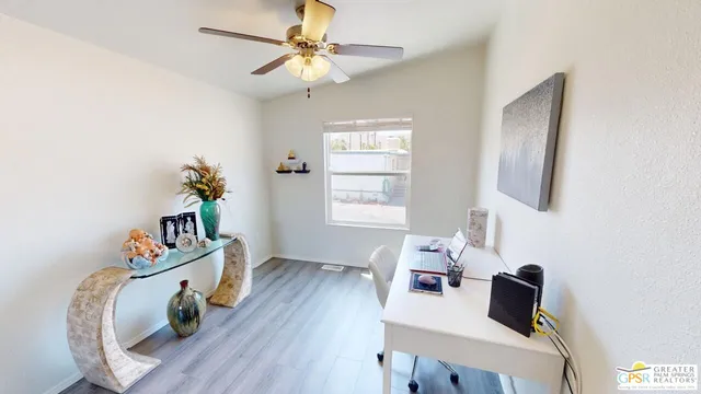 a bedroom with furniture and a window