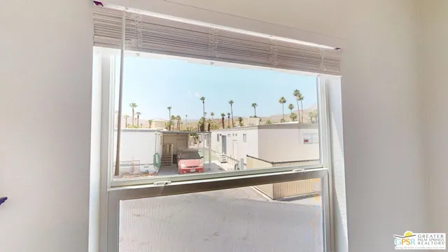 a room with kitchen view and appliances