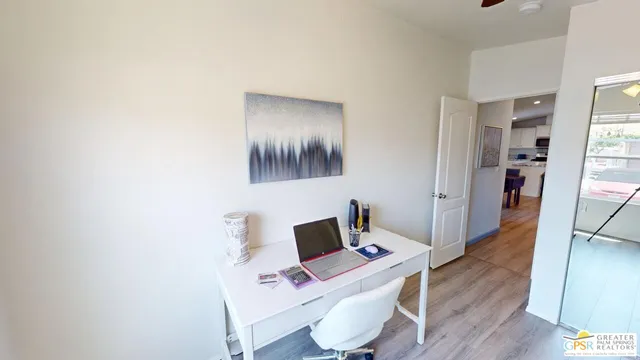 a workspace with furniture and wooden floor