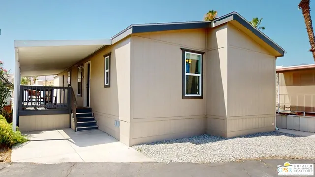 a backyard of a house with seating space