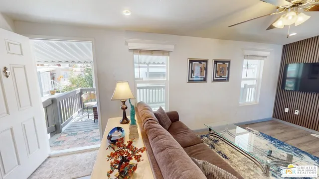 a living room with furniture and a window