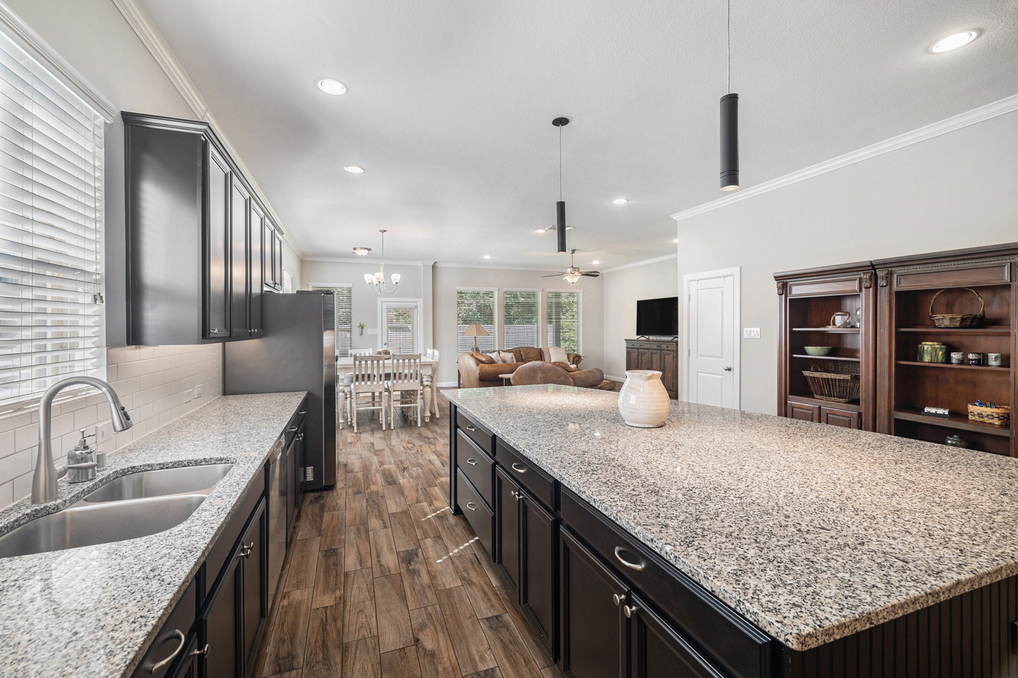 1126 Audrey Trail Tomball, TX 77375 - Photo 12 of 35 a kitchen with granite countertop kitchen island stainless steel appliances lots of counter space