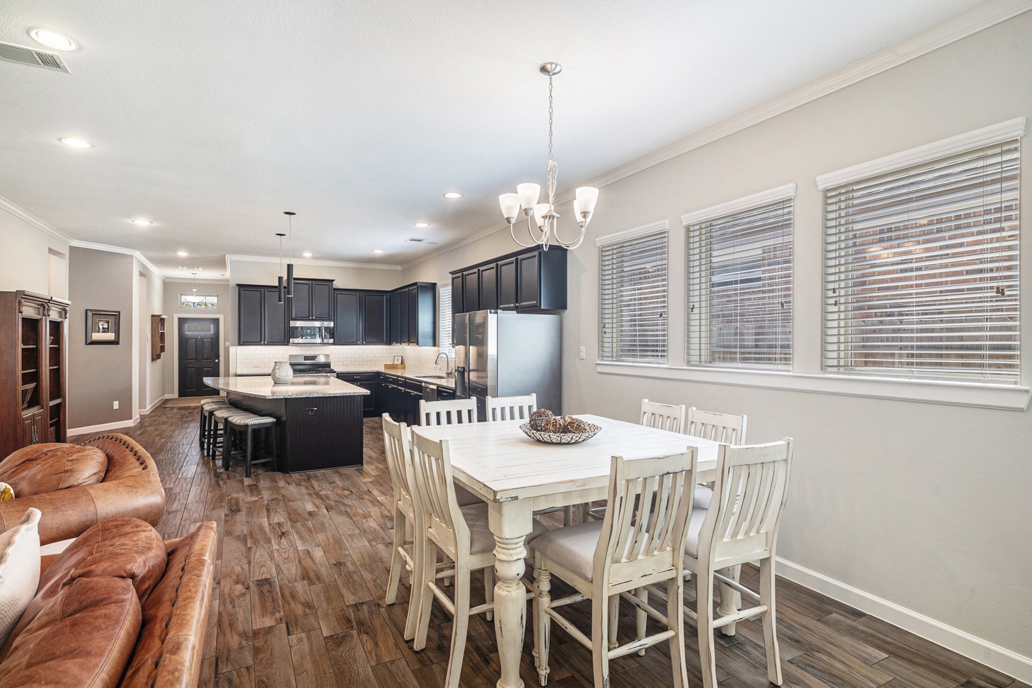 1126 Audrey Trail Tomball, TX 77375 - Photo 14 of 35 a view of a dining room with furniture wooden floor and chandelier
