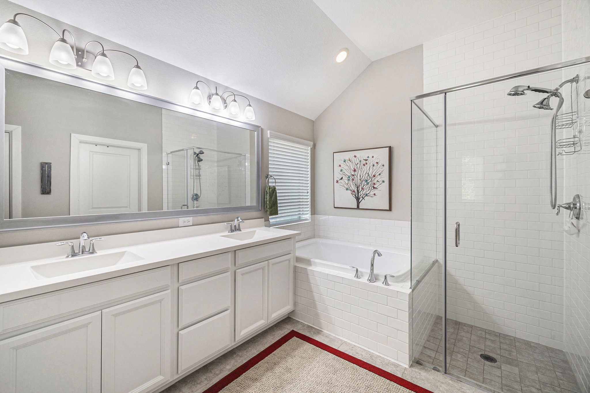 1126 Audrey Trail Tomball, TX 77375 - Photo 21 of 35 a bathroom with a double vanity sink mirror and shower