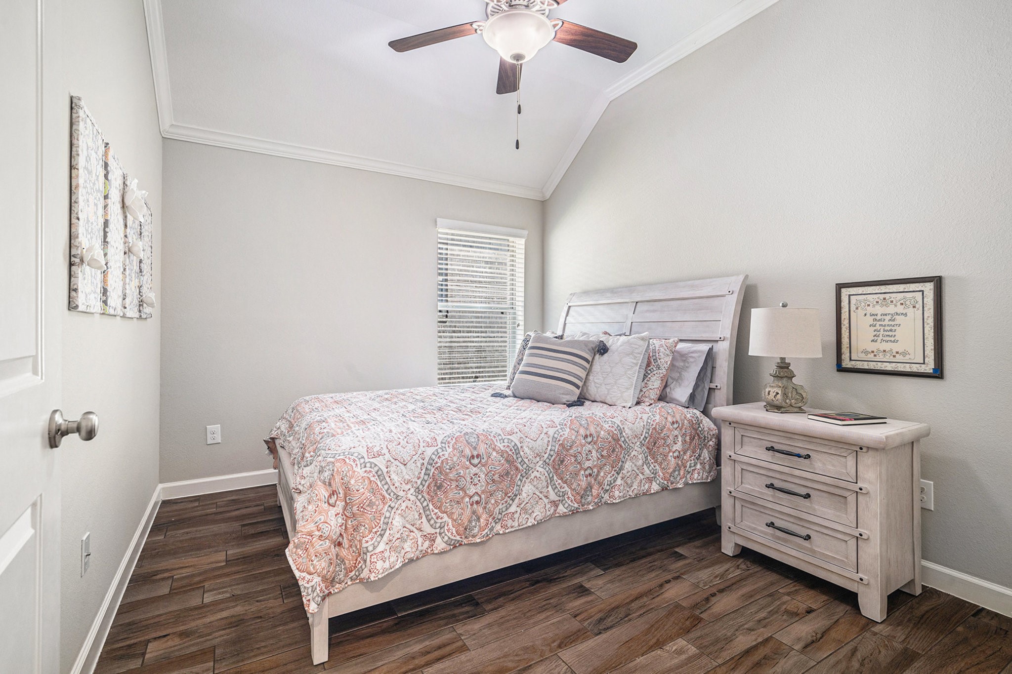1126 Audrey Trail Tomball, TX 77375 - Photo 24 of 35 a bedroom with a bed and a chandelier