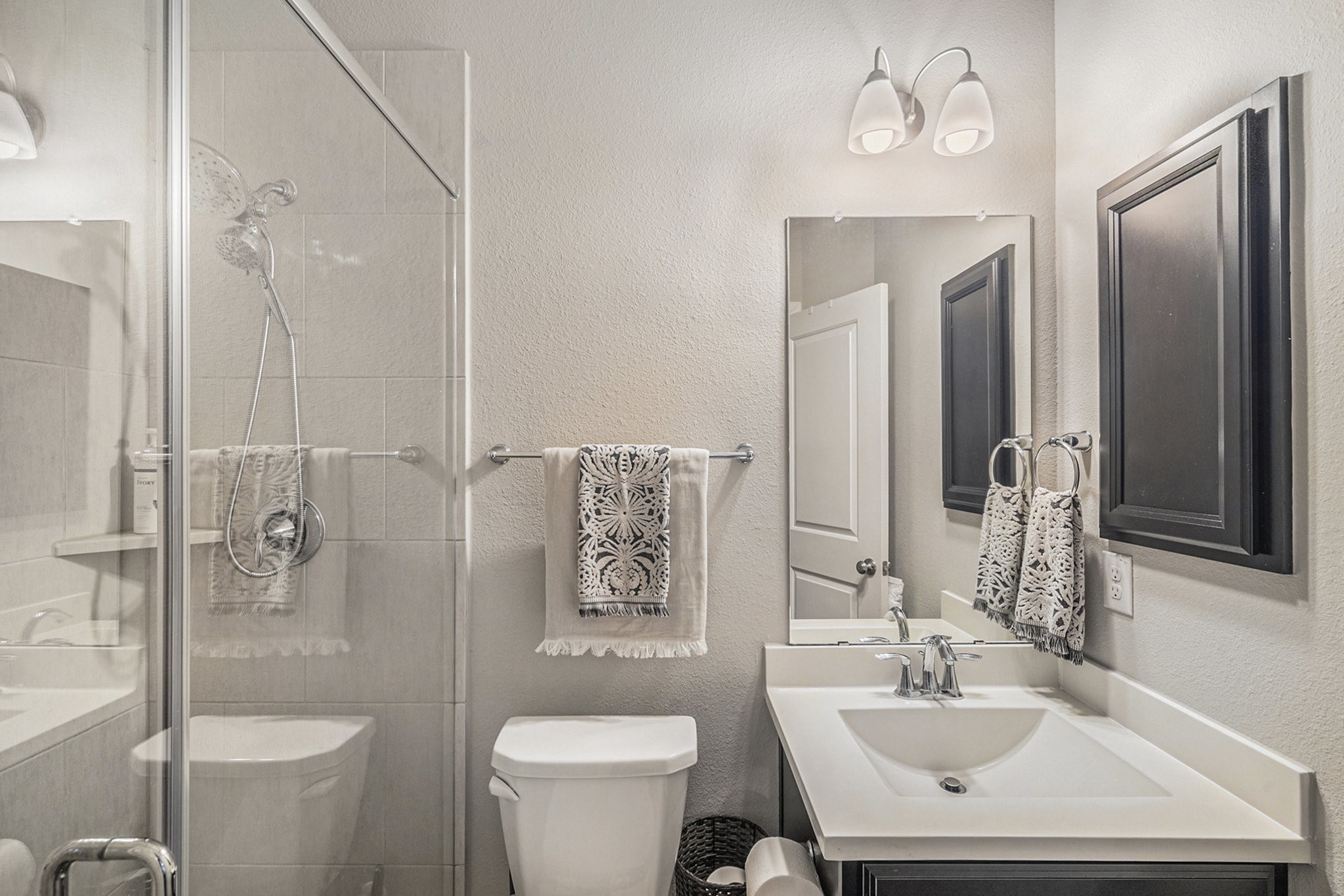 1126 Audrey Trail Tomball, TX 77375 - Photo 25 of 35 a bathroom with a sink toilet a mirror and shower