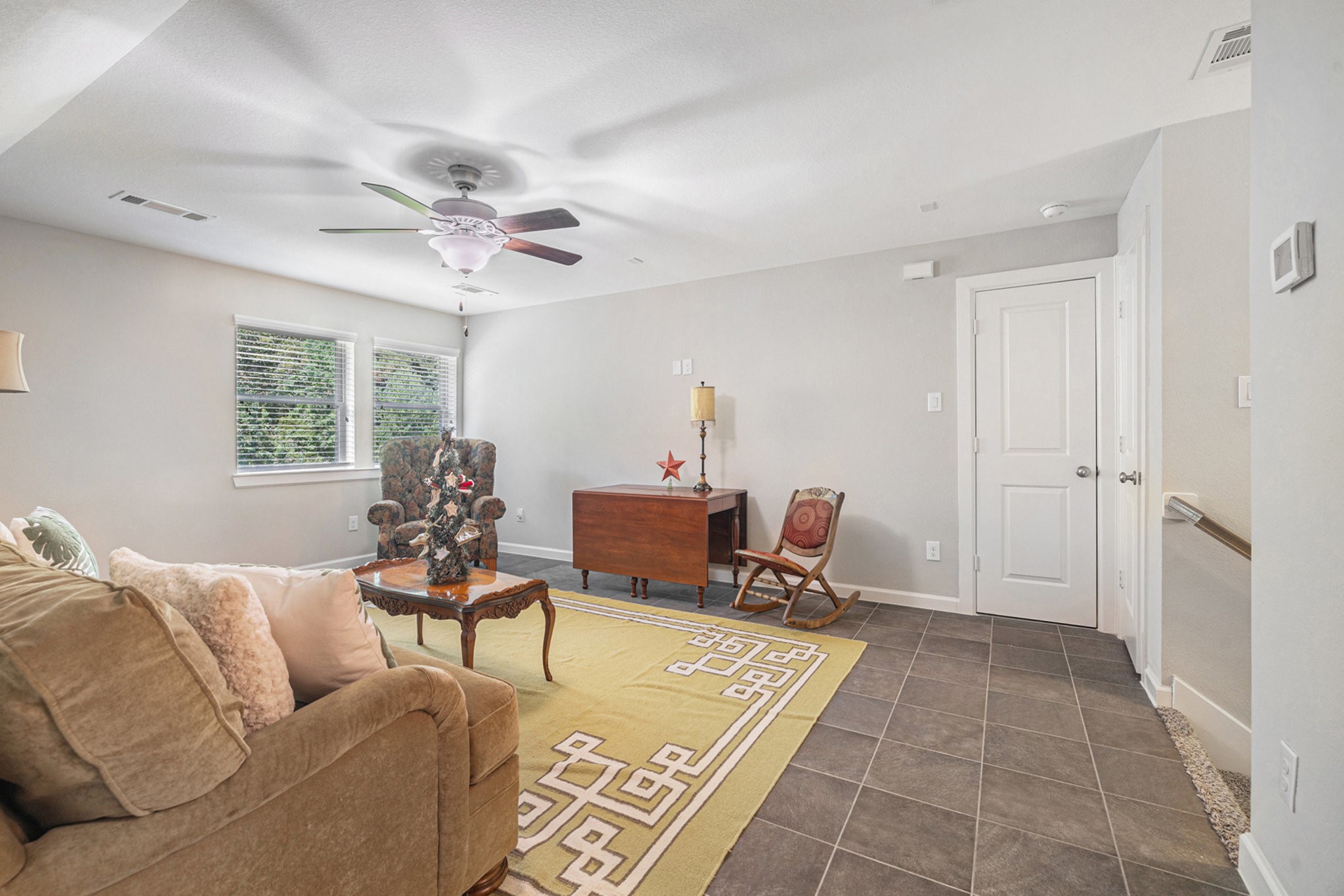 1126 Audrey Trail Tomball, TX 77375 - Photo 28 of 35 a living room with furniture and a chandelier