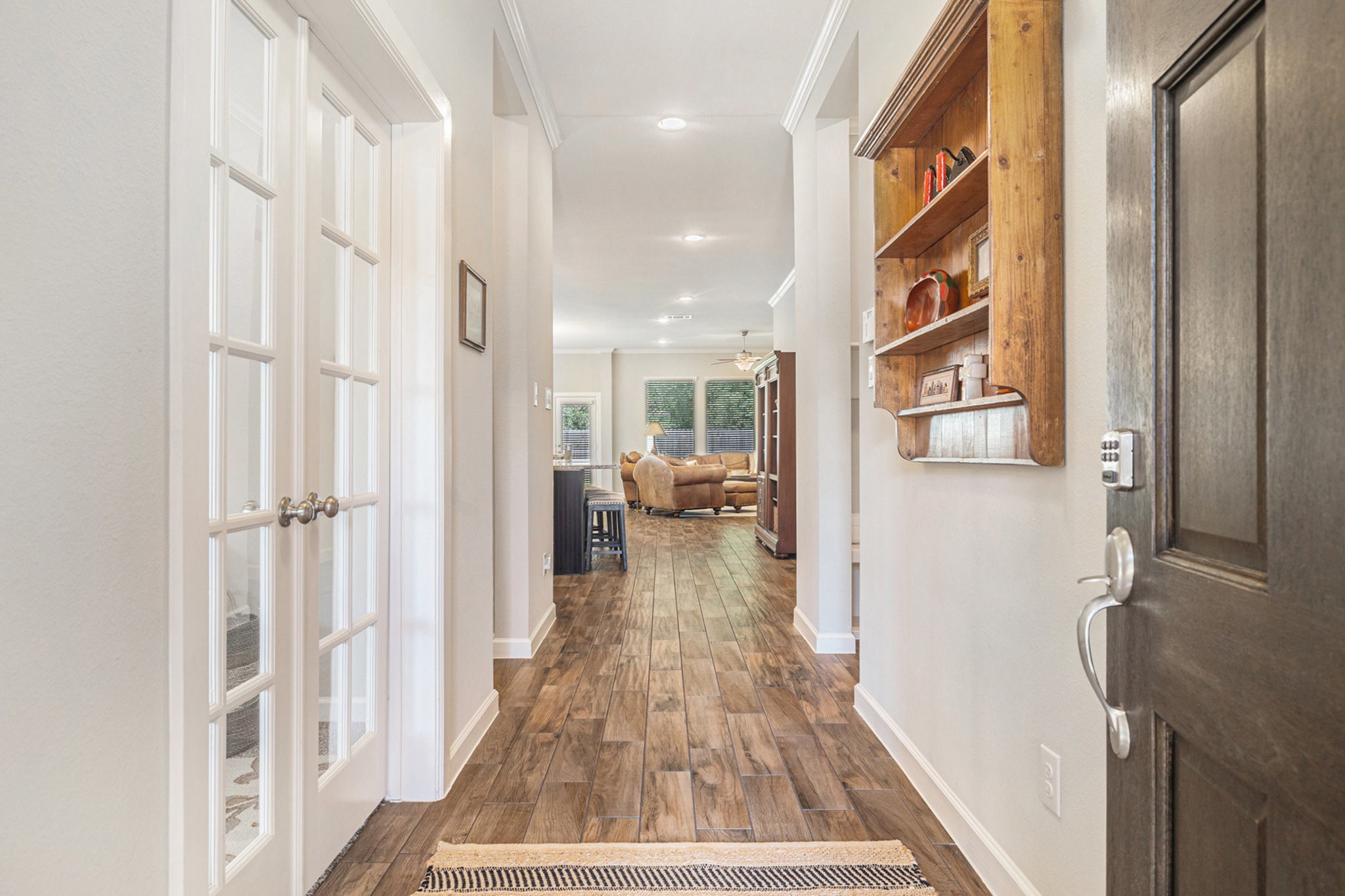 1126 Audrey Trail Tomball, TX 77375 - Photo 6 of 35 a view of a hallway with wooden floor and staircase