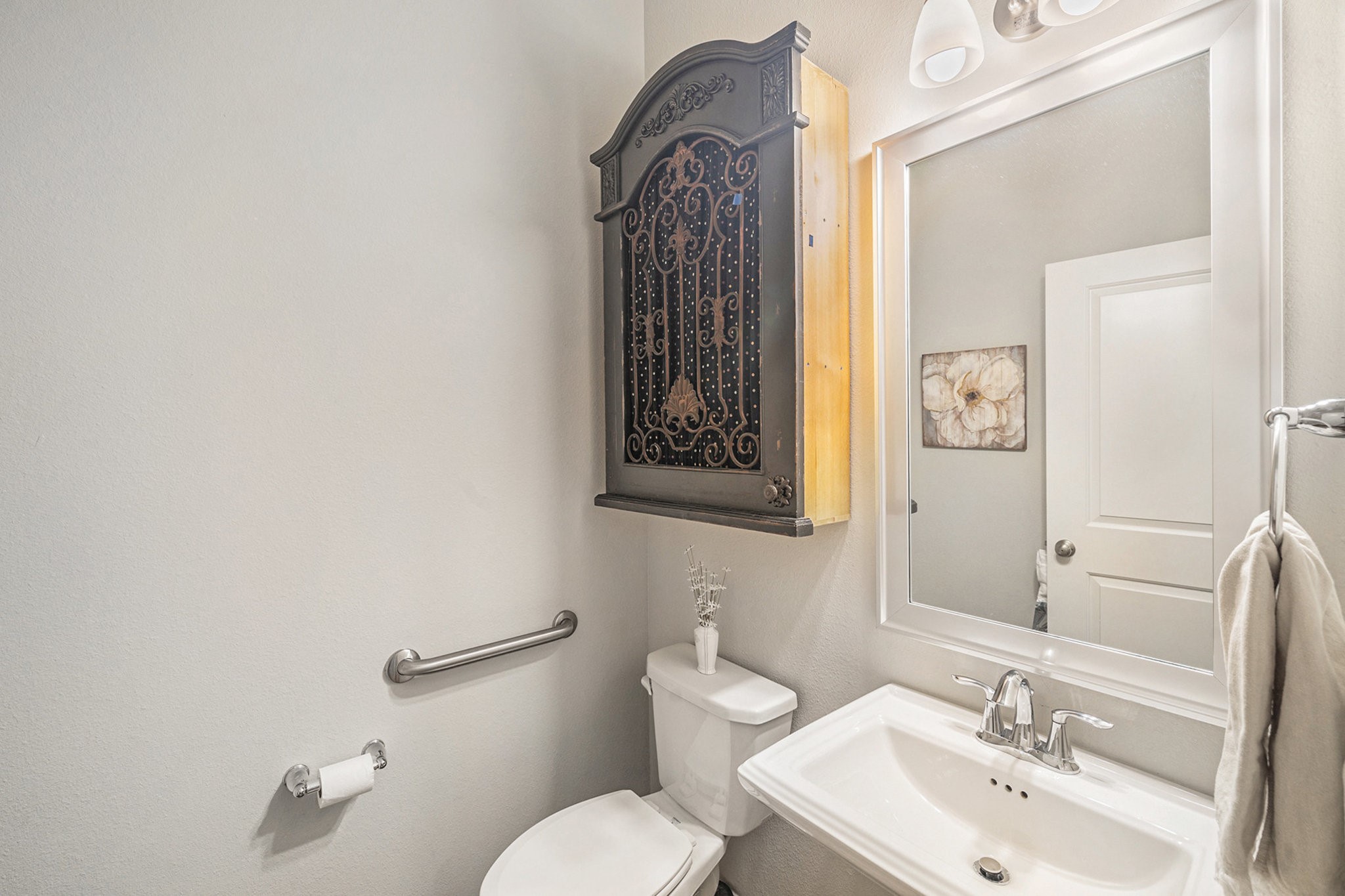 1126 Audrey Trail Tomball, TX 77375 - Photo 8 of 35 a bathroom with a toilet sink and mirror