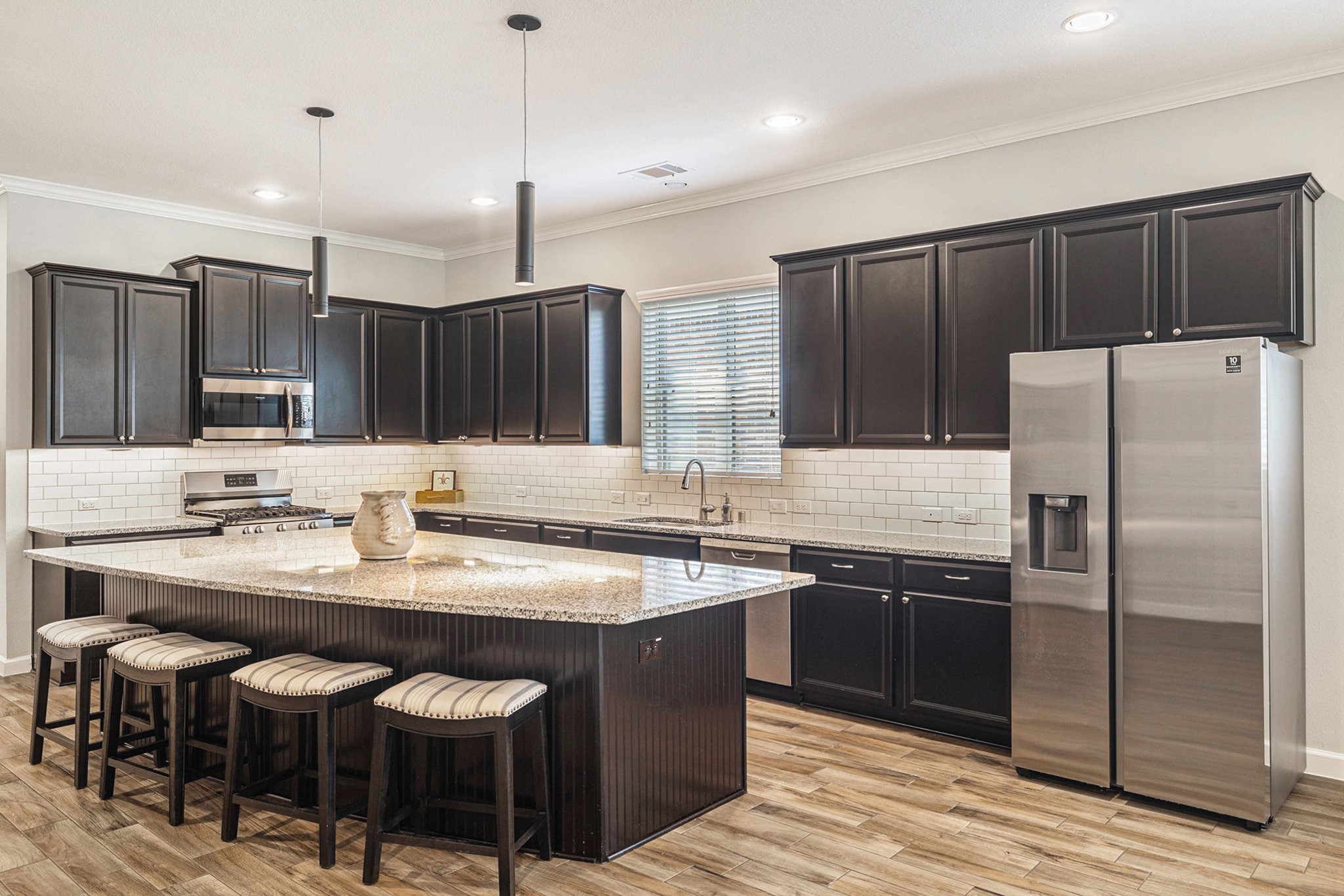 1126 Audrey Trail Tomball, TX 77375 - Photo 10 of 35 a kitchen with stainless steel appliances granite countertop a sink stove and refrigerator