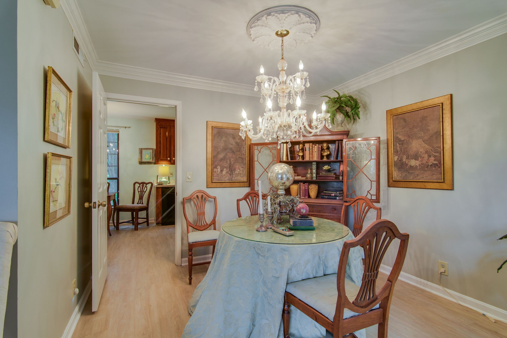 1206 General George Patton Road Nashville, TN 37221 - Photo 8 of 27 a dining room with furniture a chandelier and wooden floor