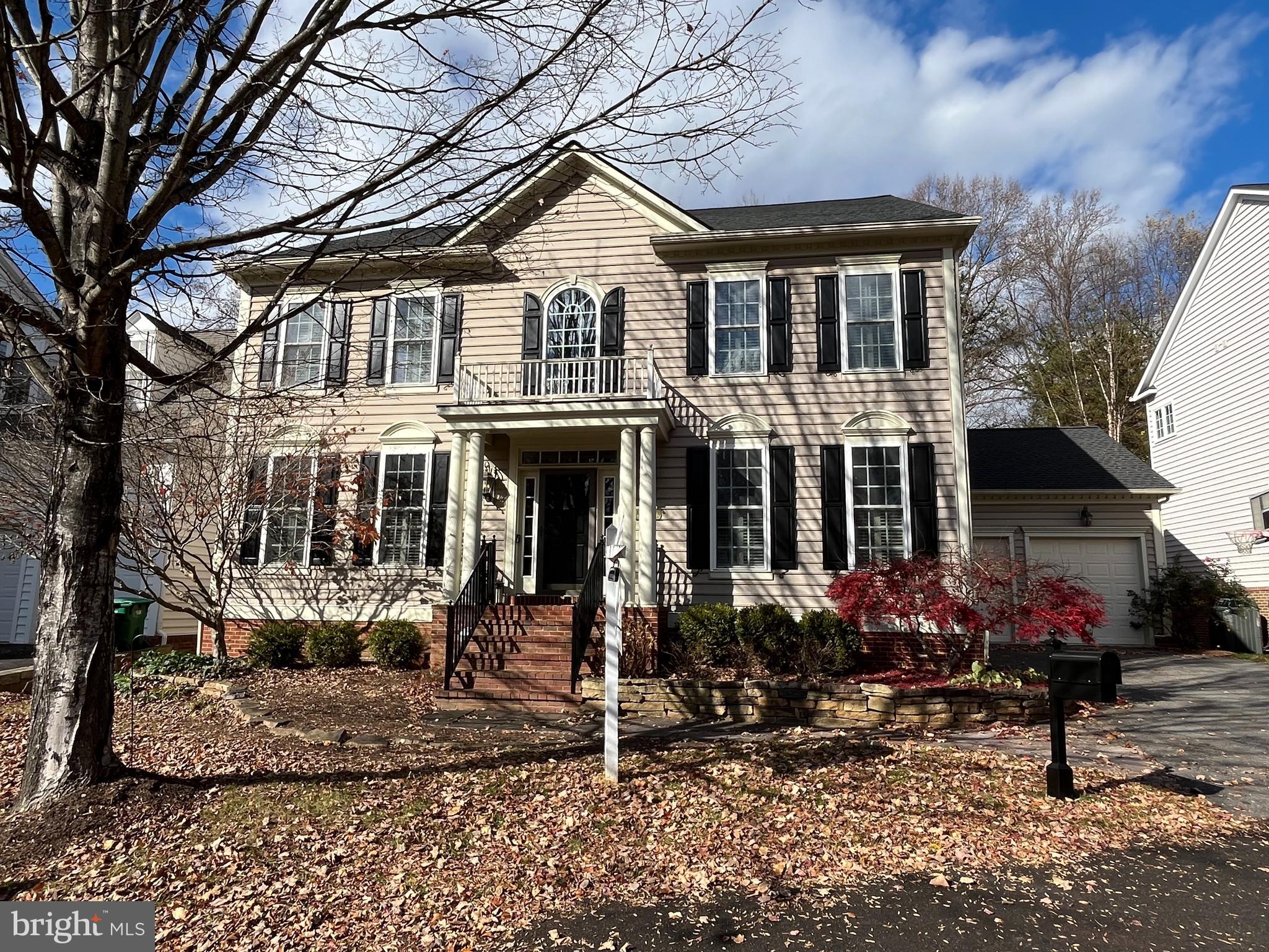 869 Still Creek Lane Gaithersburg, MD 20878 - Photo 1 of 58 a front view of a house with a yard