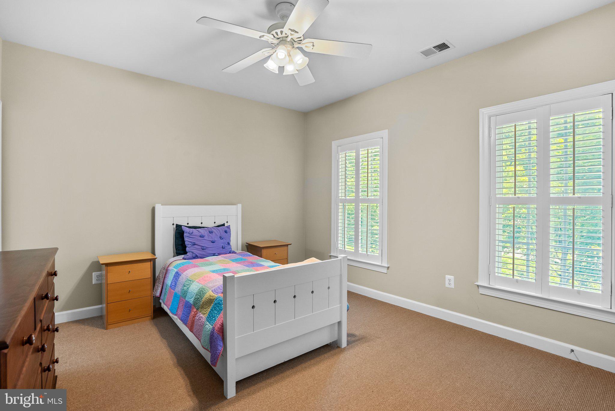 869 Still Creek Lane Gaithersburg, MD 20878 - Photo 27 of 58 a bedroom with a bed chandelier and a window
