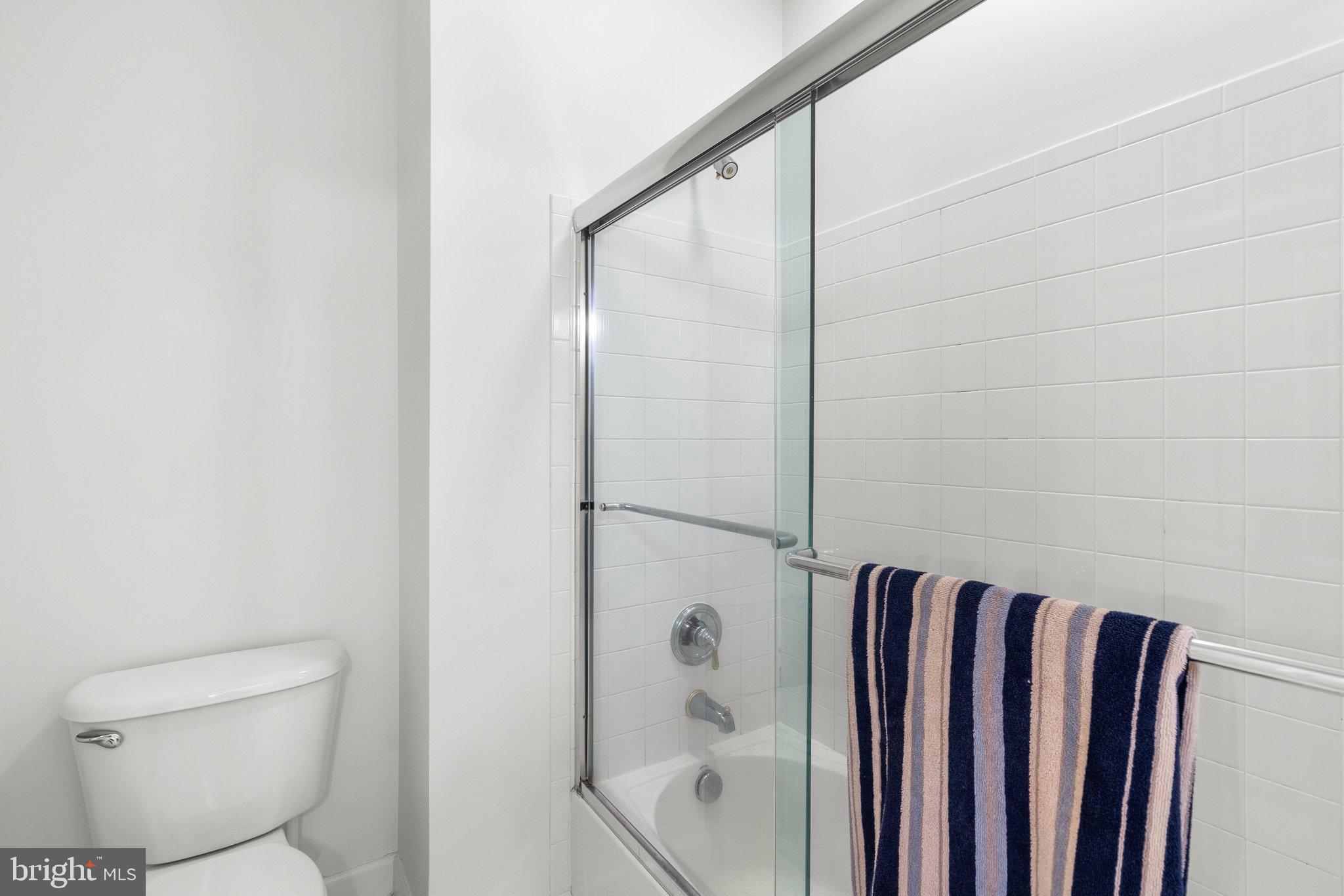 869 Still Creek Lane Gaithersburg, MD 20878 - Photo 33 of 58 a bathroom with a shower and a toilet