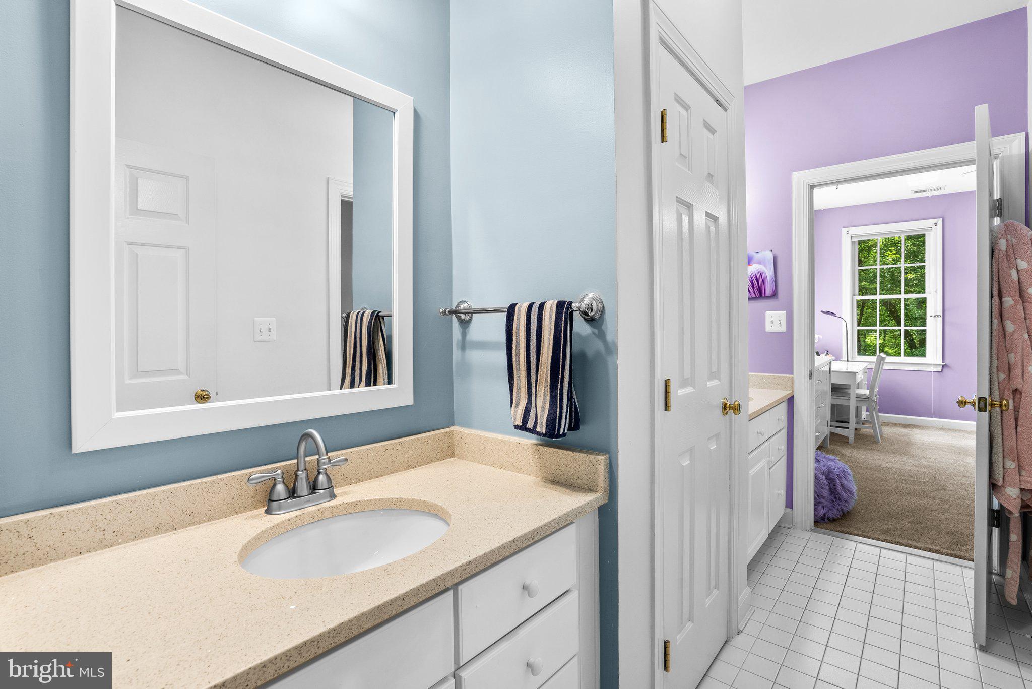 869 Still Creek Lane Gaithersburg, MD 20878 - Photo 34 of 58 a en suite bathroom with a granite countertop sink and a mirror