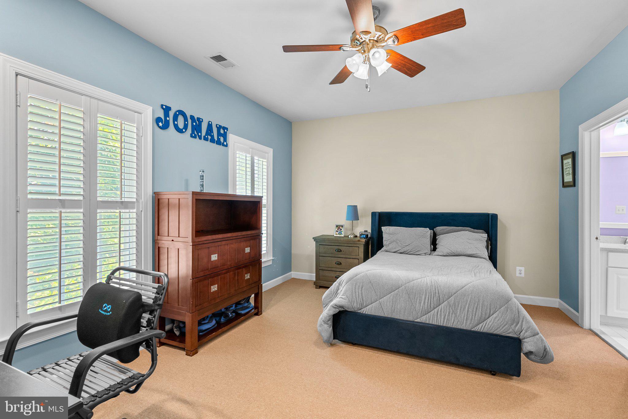 869 Still Creek Lane Gaithersburg, MD 20878 - Photo 35 of 58 a bedroom with a bed and a flat screen tv