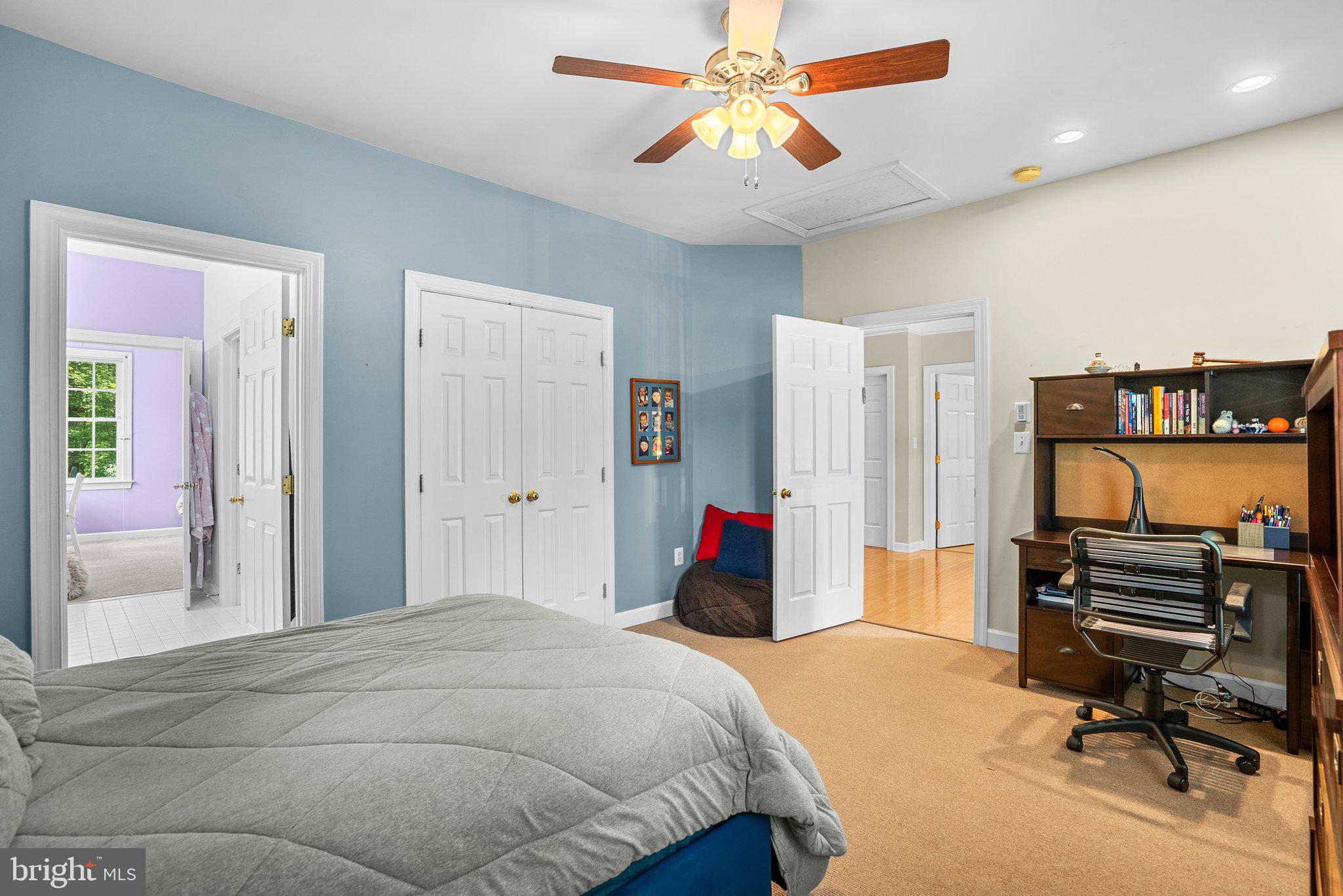 869 Still Creek Lane Gaithersburg, MD 20878 - Photo 36 of 58 a bedroom with a bed dresser and a chandelier