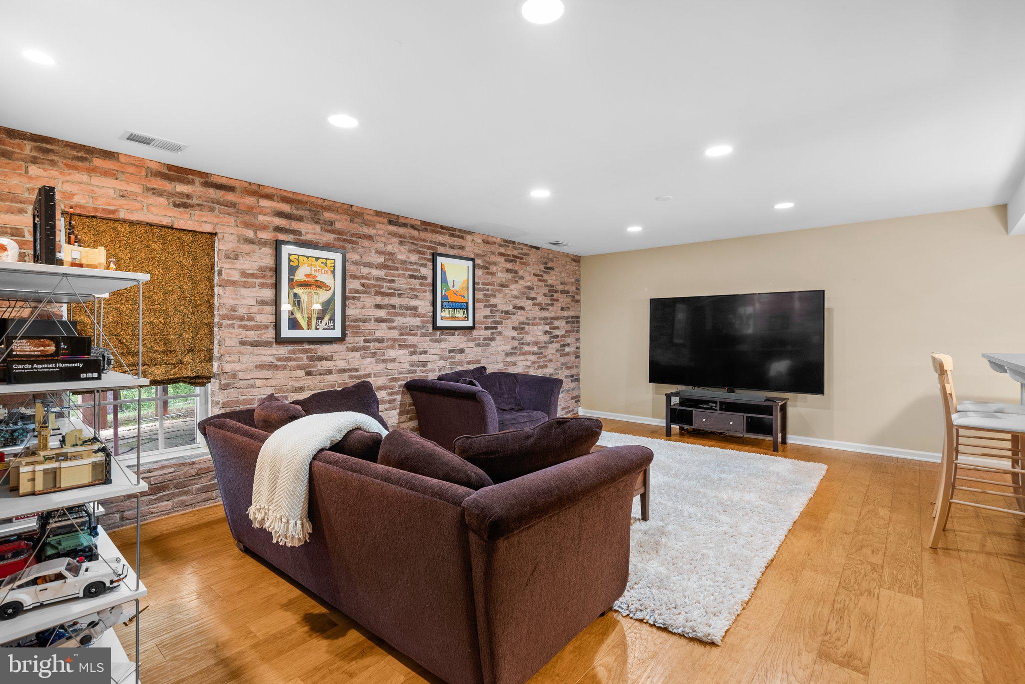 869 Still Creek Lane Gaithersburg, MD 20878 - Photo 37 of 58 a living room with furniture and a flat screen tv